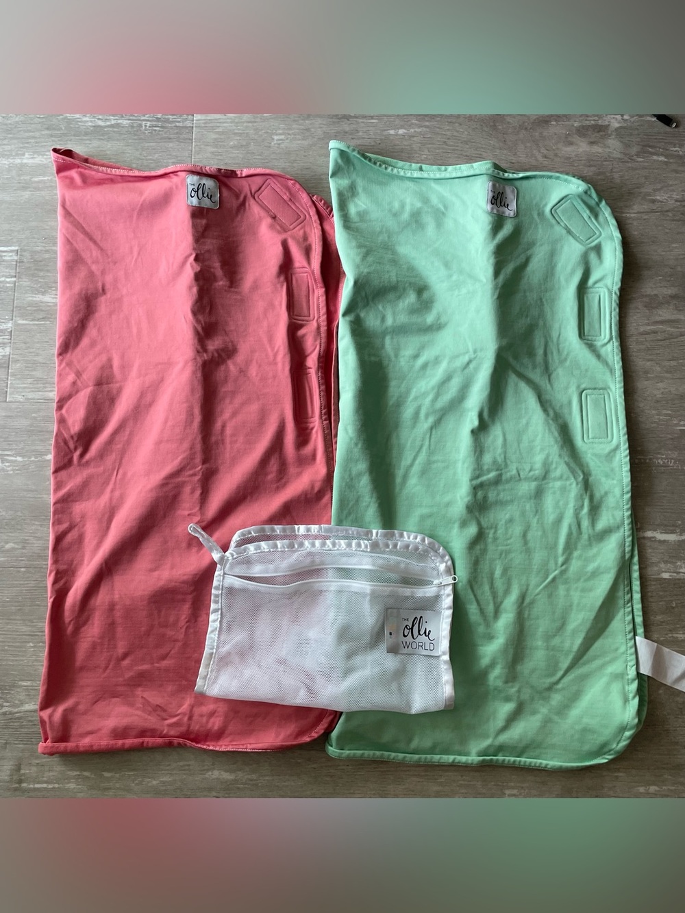 EUC/like new Two Ollie Swaddles in Mint and Coral (green and rust orangey red)